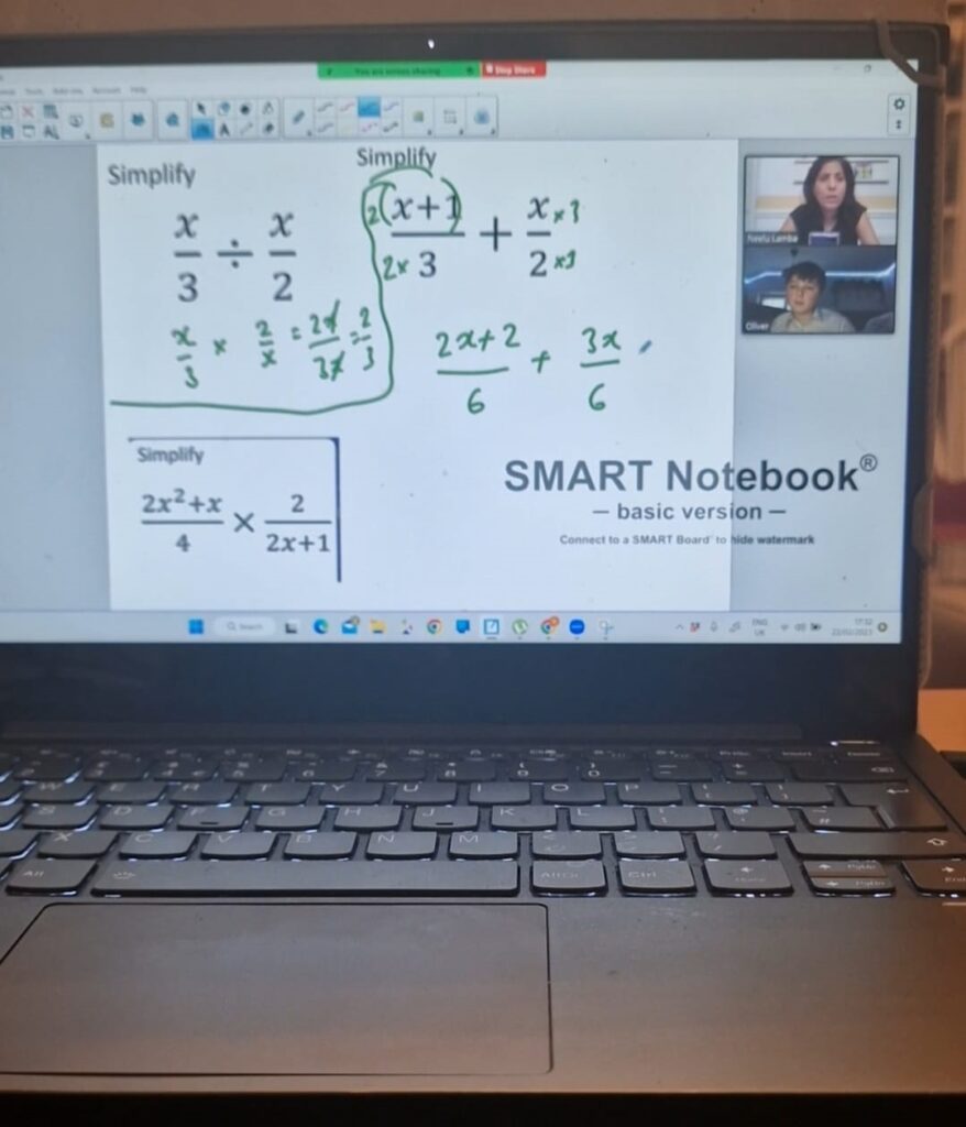 An online maths lesson on a laptop, algebra being worked through on a shared whiteboard